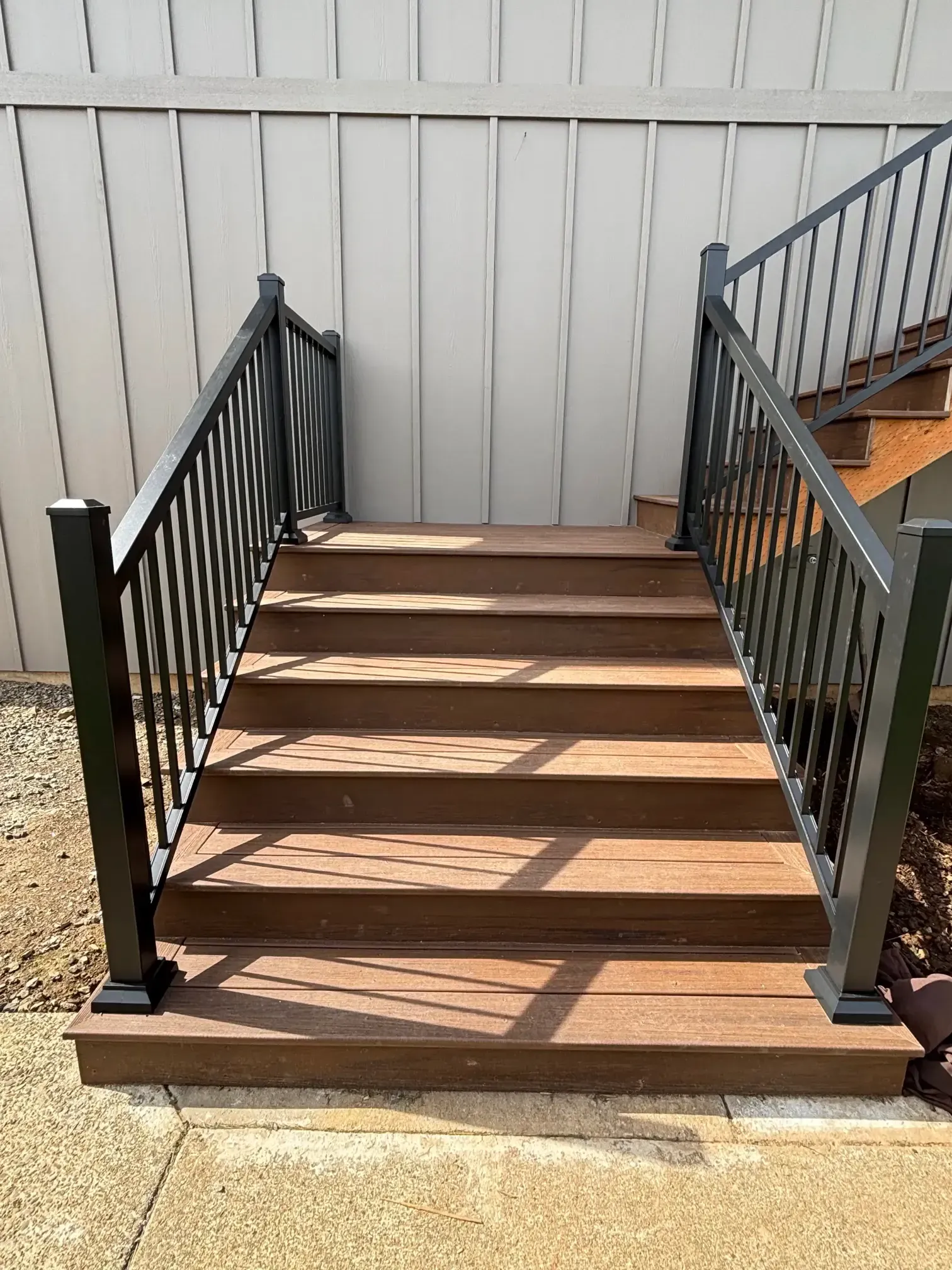 Close-up of the bottom steps and black railing base.