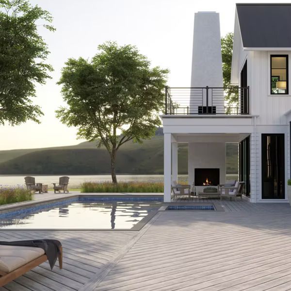 A white house with a swimming pool and a fireplace