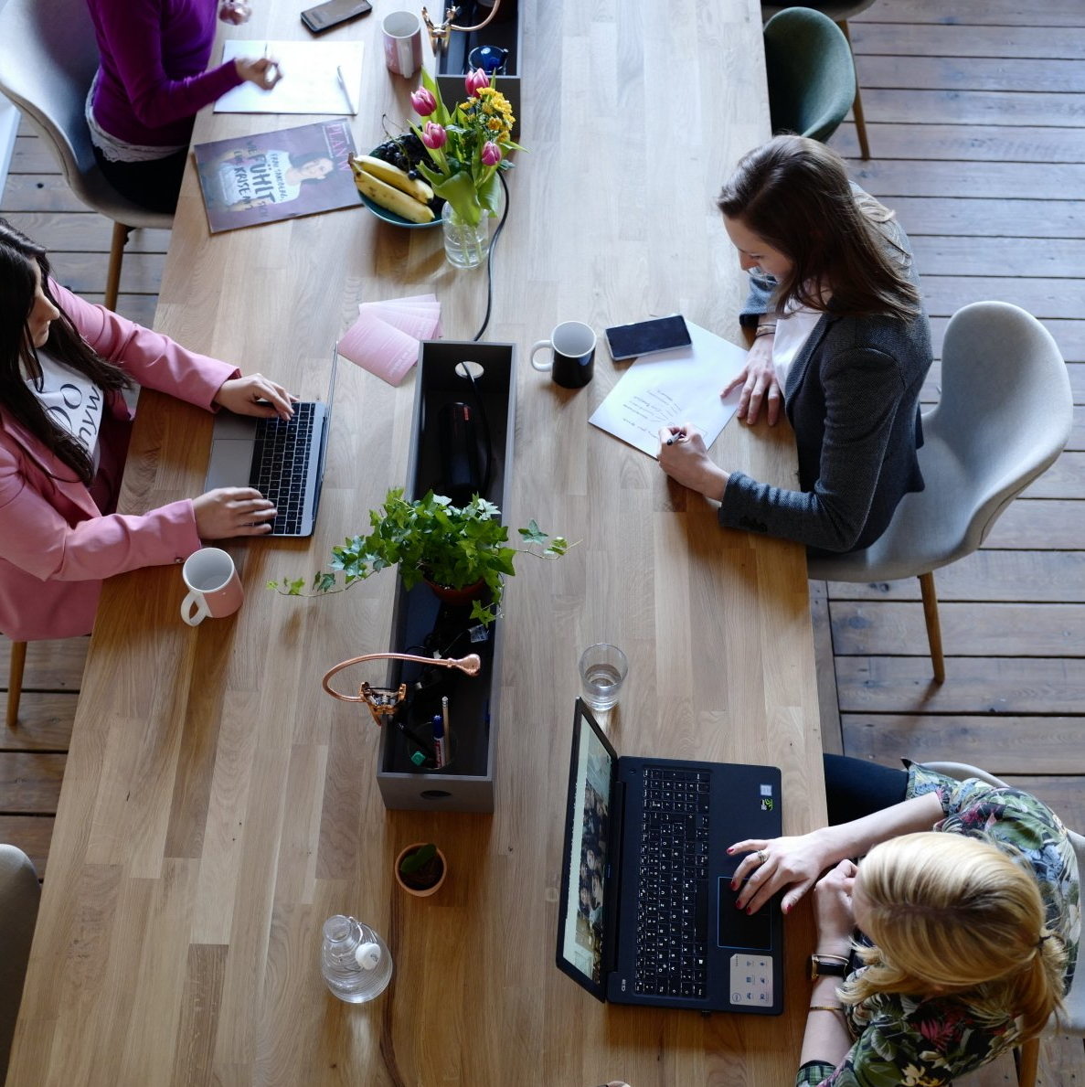 A group of employees sitting at a table working
