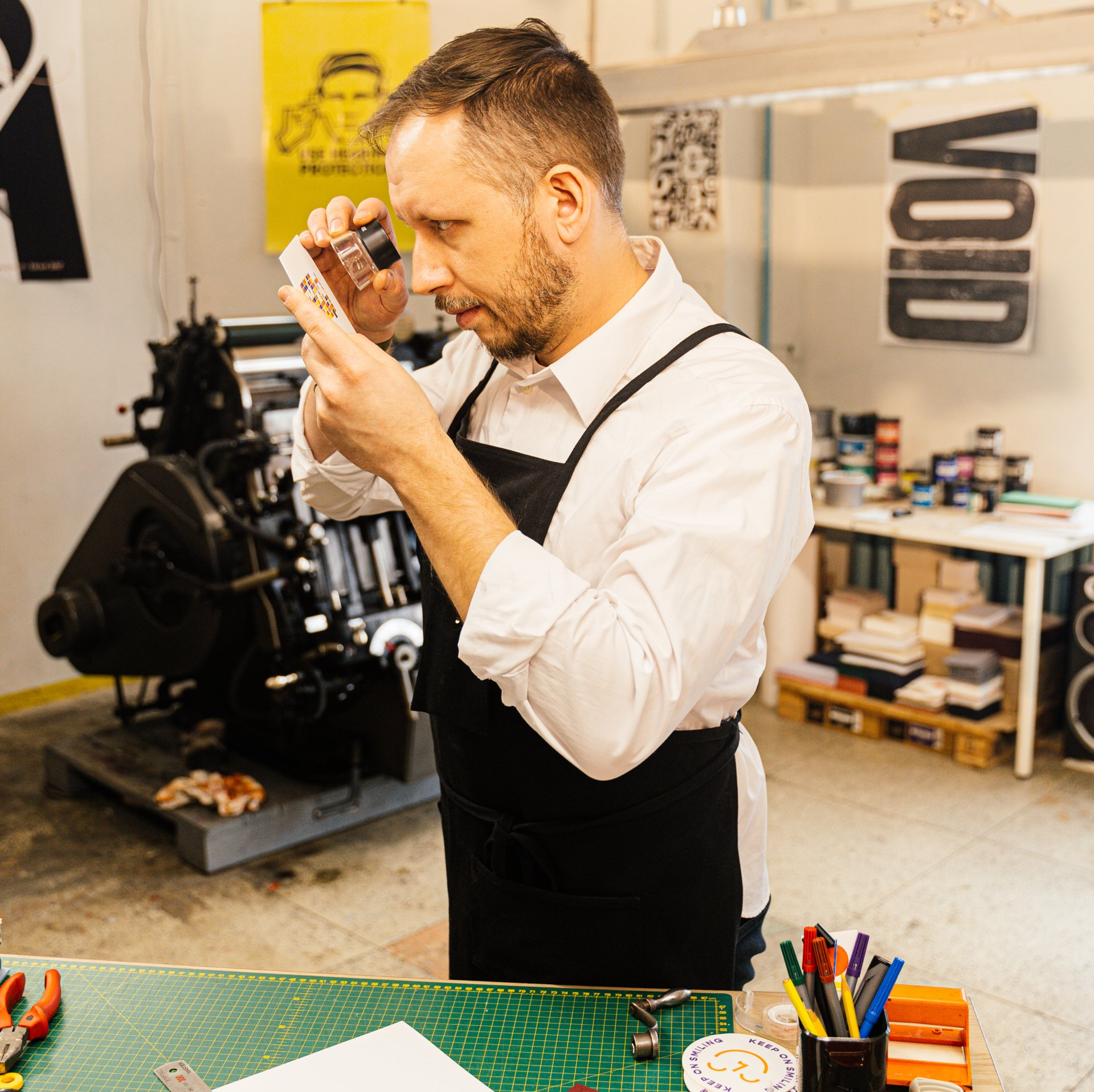 A press operator looking at a piece