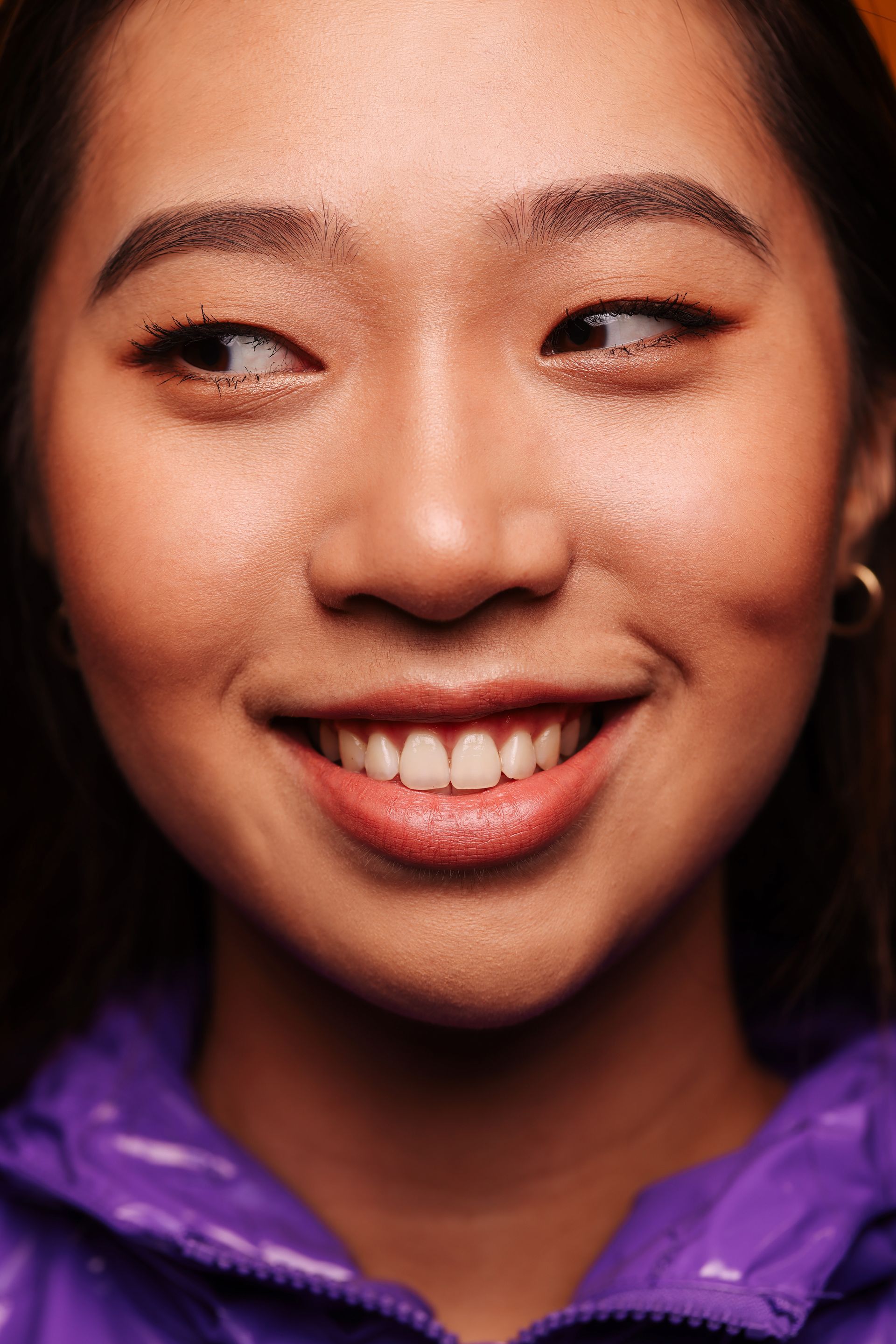 Smiling young woman after smile correction