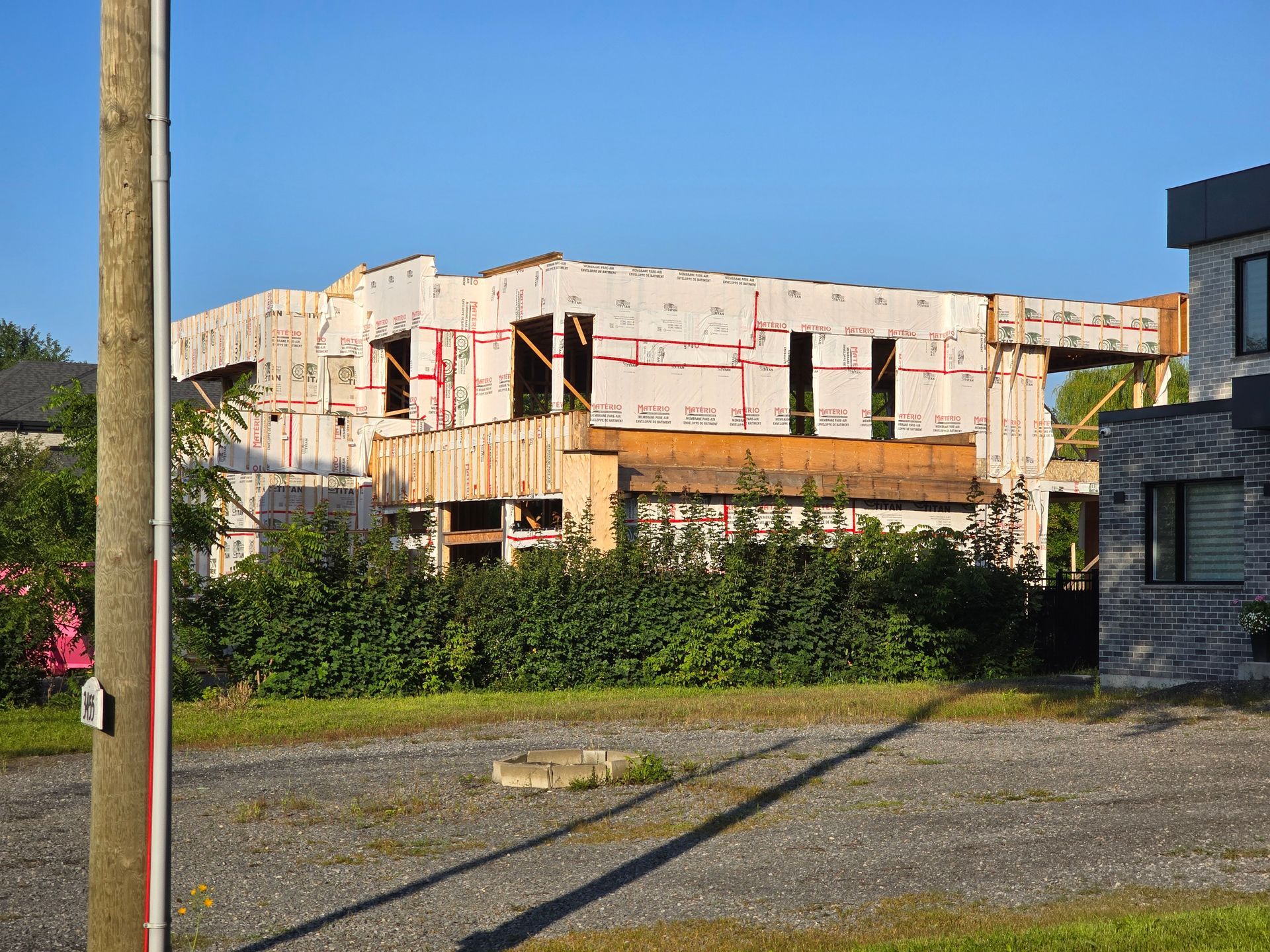A large house is being built in a residential area.