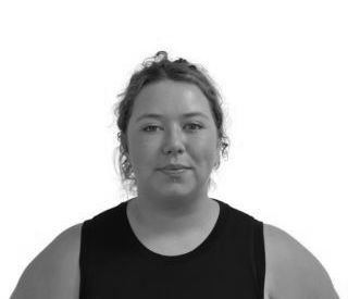 Portrait of a person against a white background, wearing a black sleeveless top, facing forward with a neutral expression
