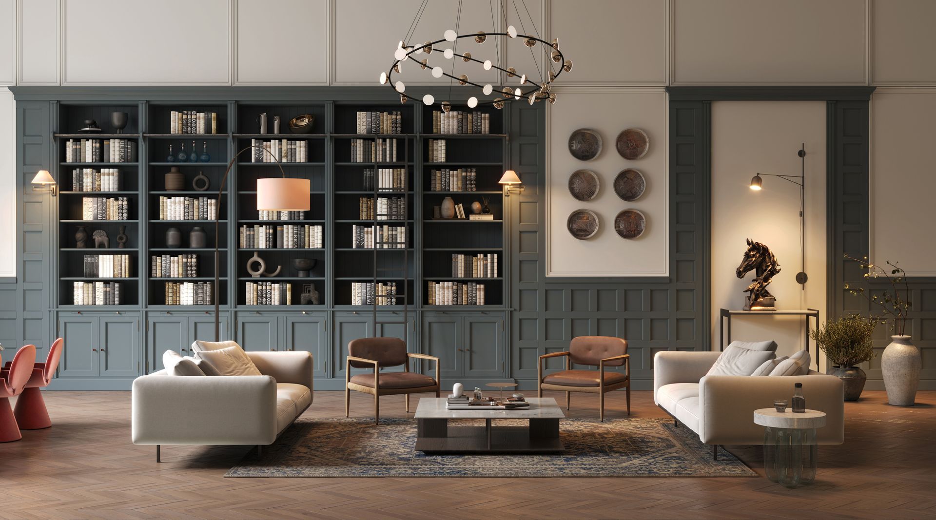 Soggiorno con librerie integrate, due divani, poltrone, tavolino e oggetti decorativi.