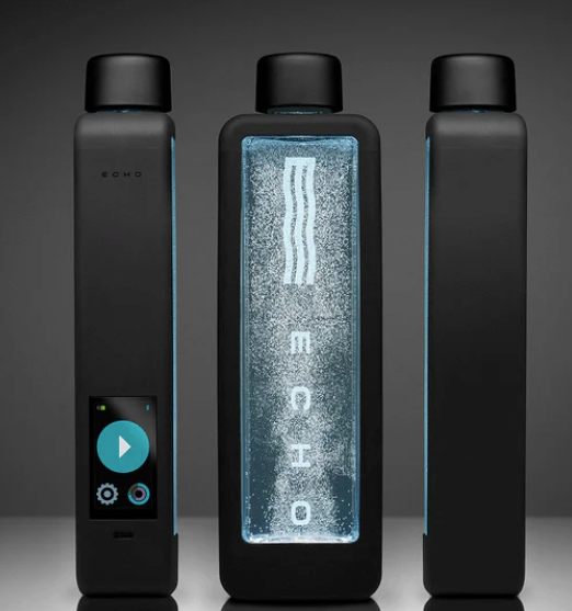 Three black rectangular devices; center one glows with a blue display and logo.