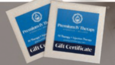 Two blue and white gift certificate cards overlapping on a light surface