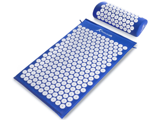 Blue acupressure mat with matching neck pillow covered in white pressure points