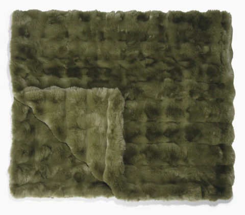 Abstract olive-green textured fabric with a lighter rectangular patch in the lower left area