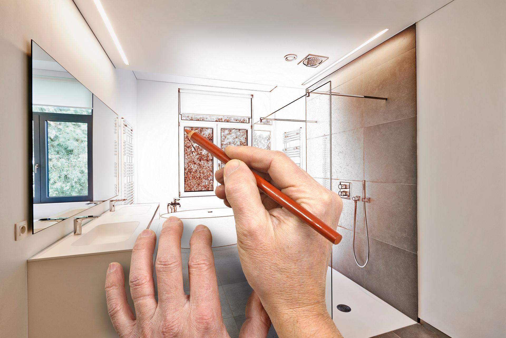 Hands sketching a modern kitchen design on a tablet with a stylus
