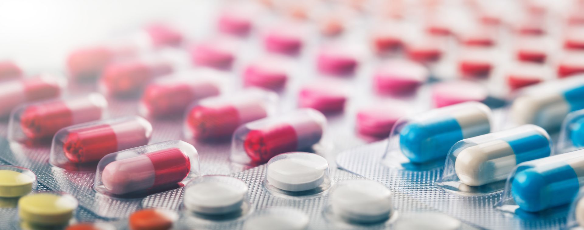 A close up of a blister pack of pills and capsules.