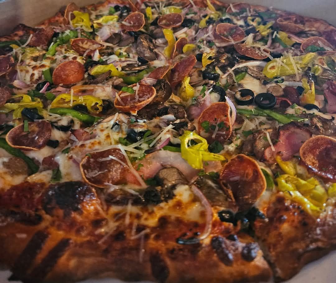  pizza with a lot of toppings