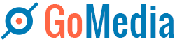 A blue and red logo for gomedia with a magnifying glass