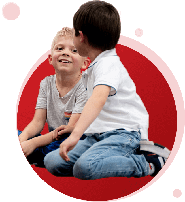 Two boys smiling at each other