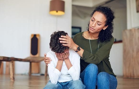 A mother sitting with her child
