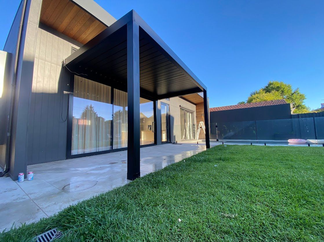 A Retractable Roof System Above A Patio — Night & Day Blinds and Awnings in Pakenham, VIC