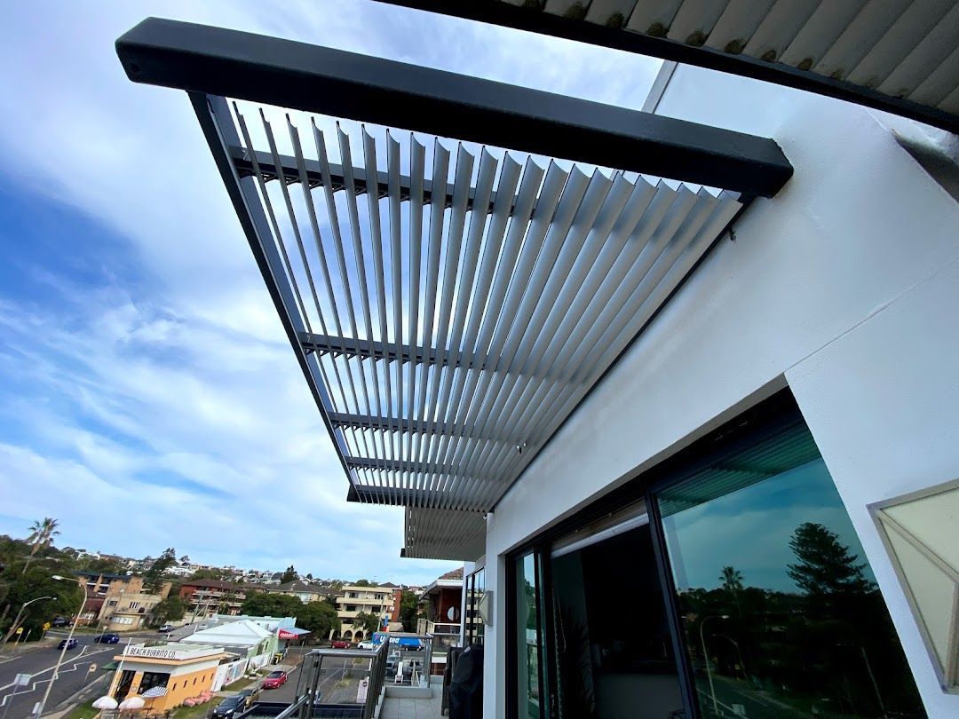 A Roof System off a White Building — Night & Day Blinds and Awnings in Pakenham, VIC