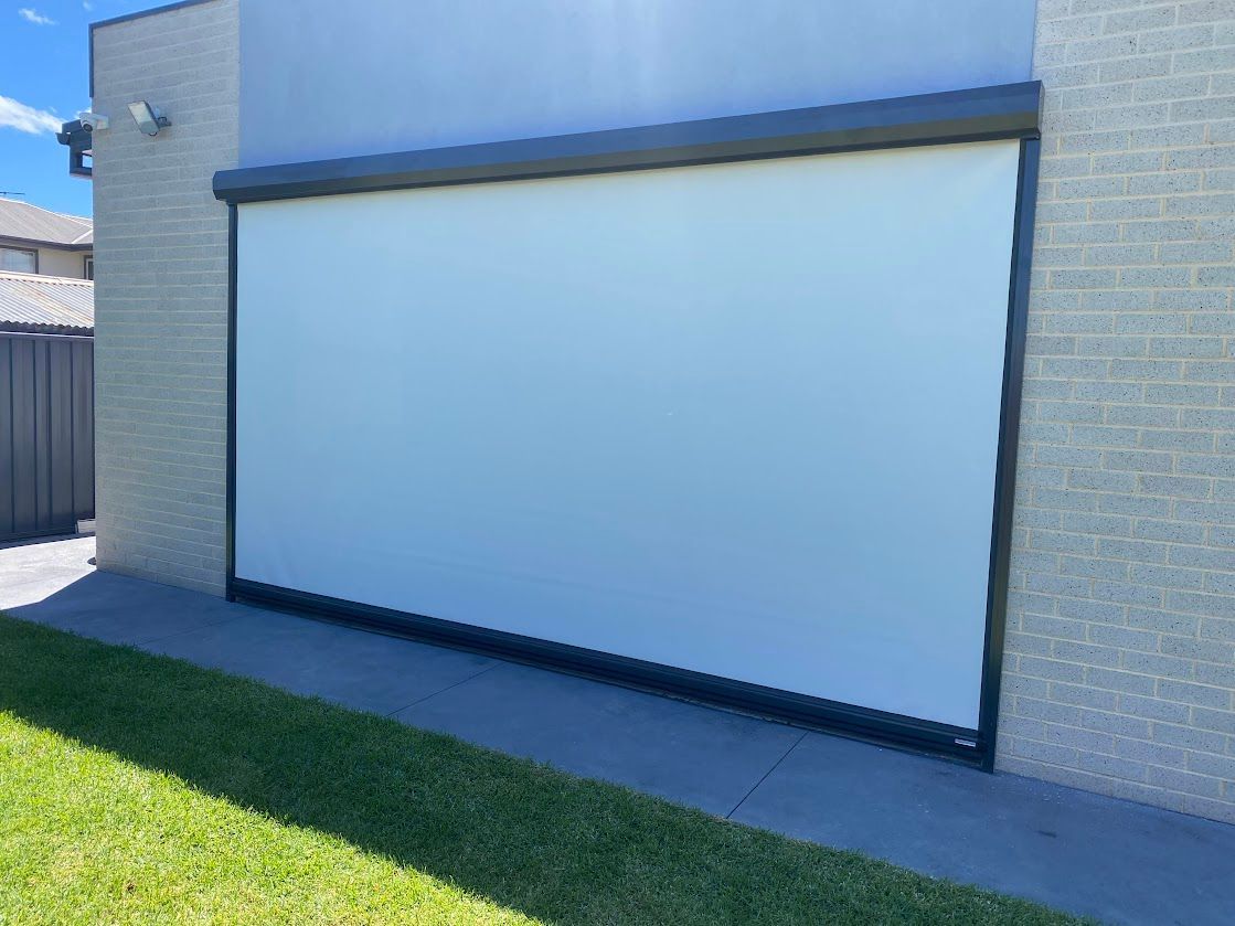 A Roll Down White Blind Outside — Night & Day Blinds and Awnings in Pakenham, VIC