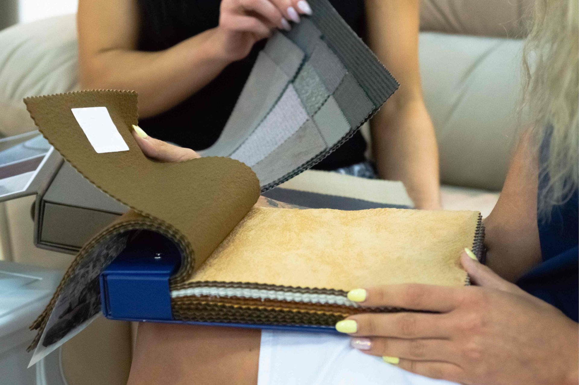 A designer and client browsing fabric options in a Hunter Douglas showroom near Lutherville, Maryland (MD)