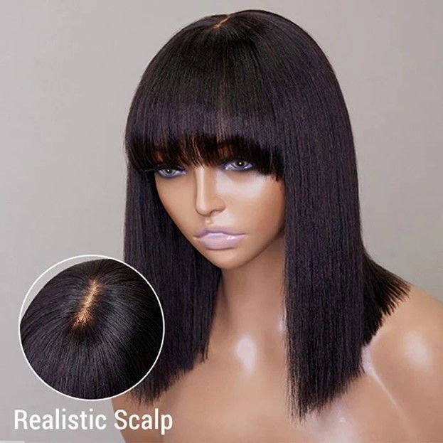 A woman is wearing a black wig with bangs.