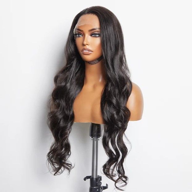 A mannequin head with a wig on it