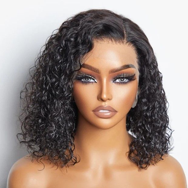 A woman with curly hair is wearing a wig