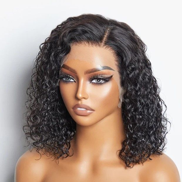 A woman with curly hair is wearing a wig
