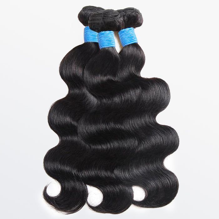 Three bundles of hair are stacked on top of each other on a white surface