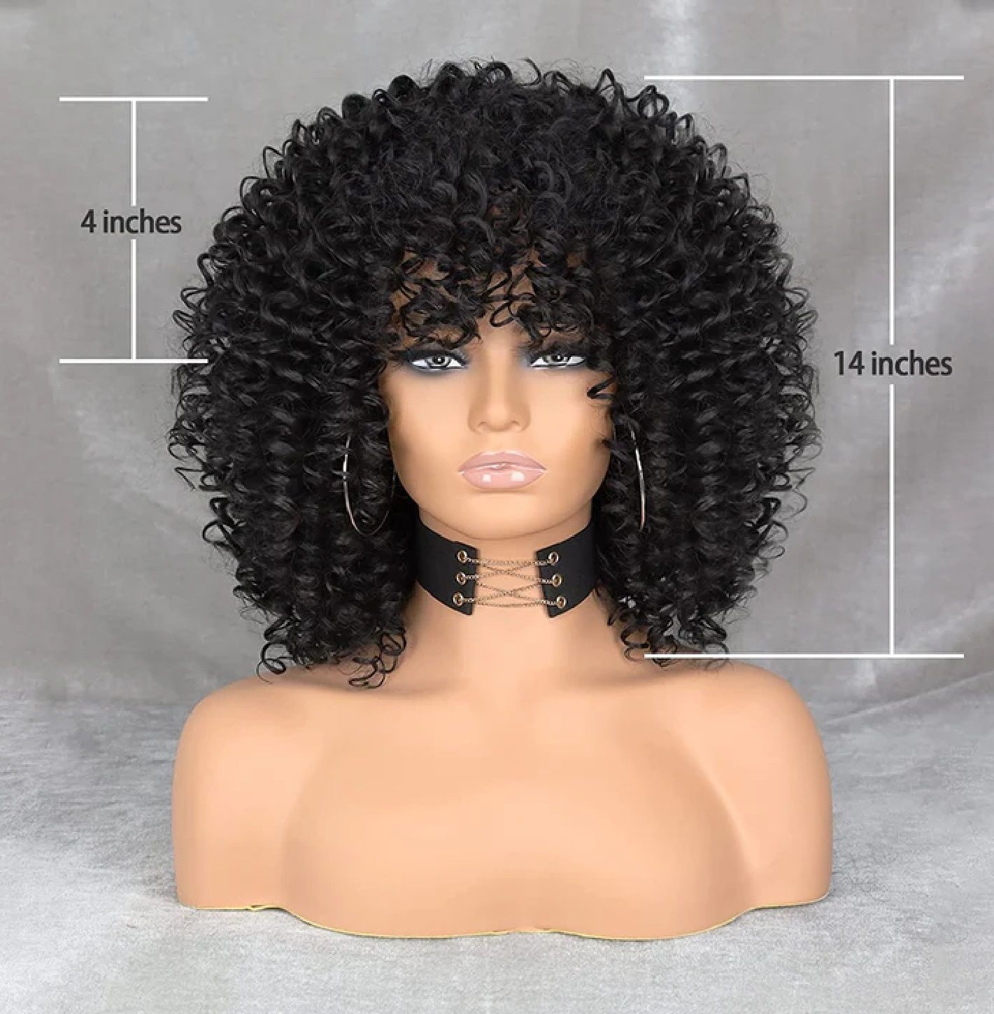 A mannequin is wearing a curly wig and choker.
