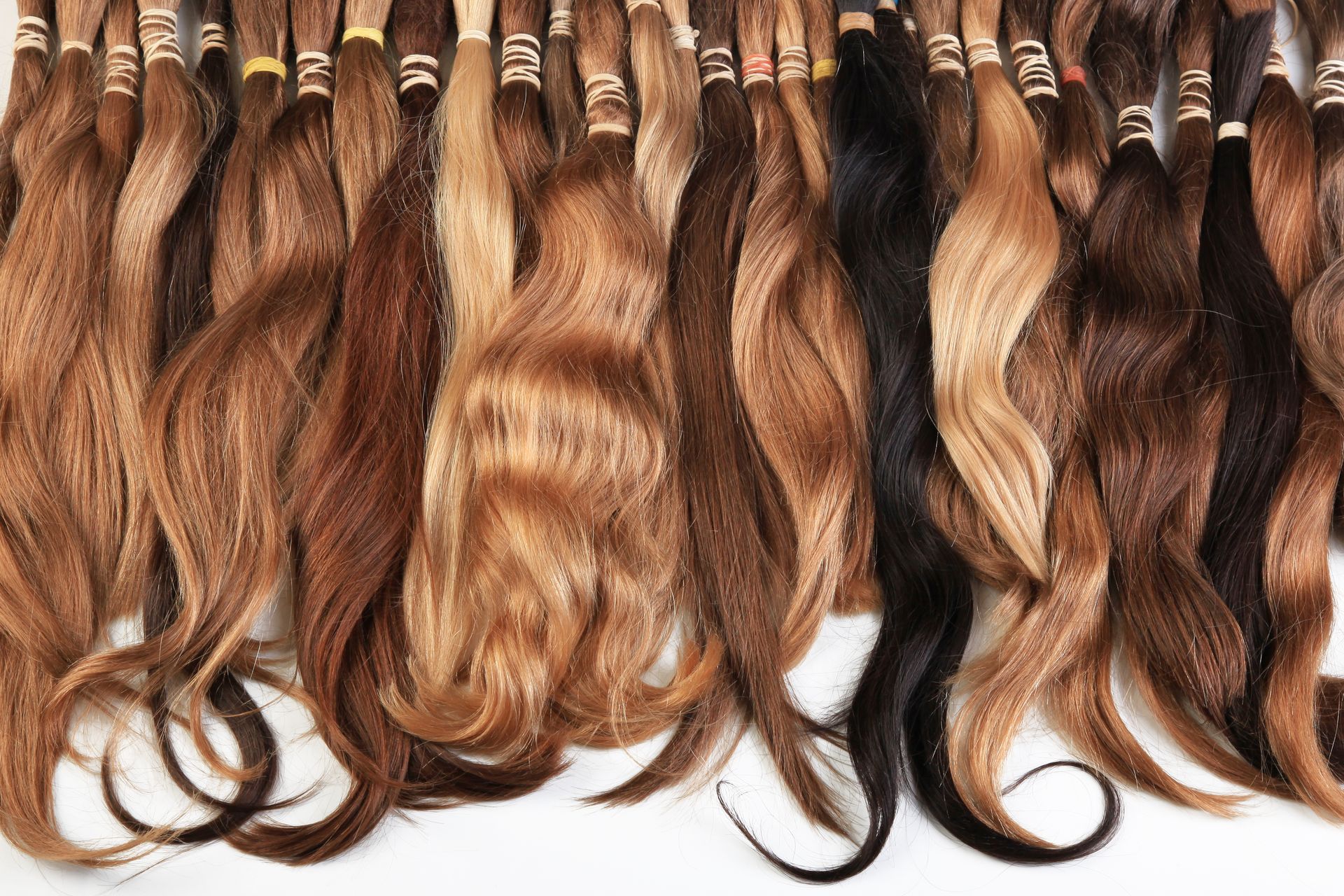 A bunch of hair extensions are lined up in a row