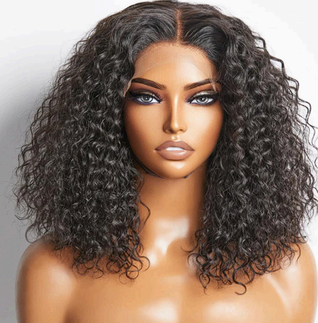 A woman with curly hair is wearing a lace front wig.