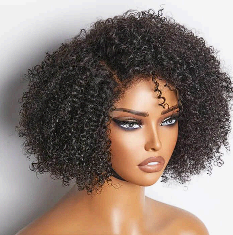 A woman with curly hair is wearing a wig on a mannequin.