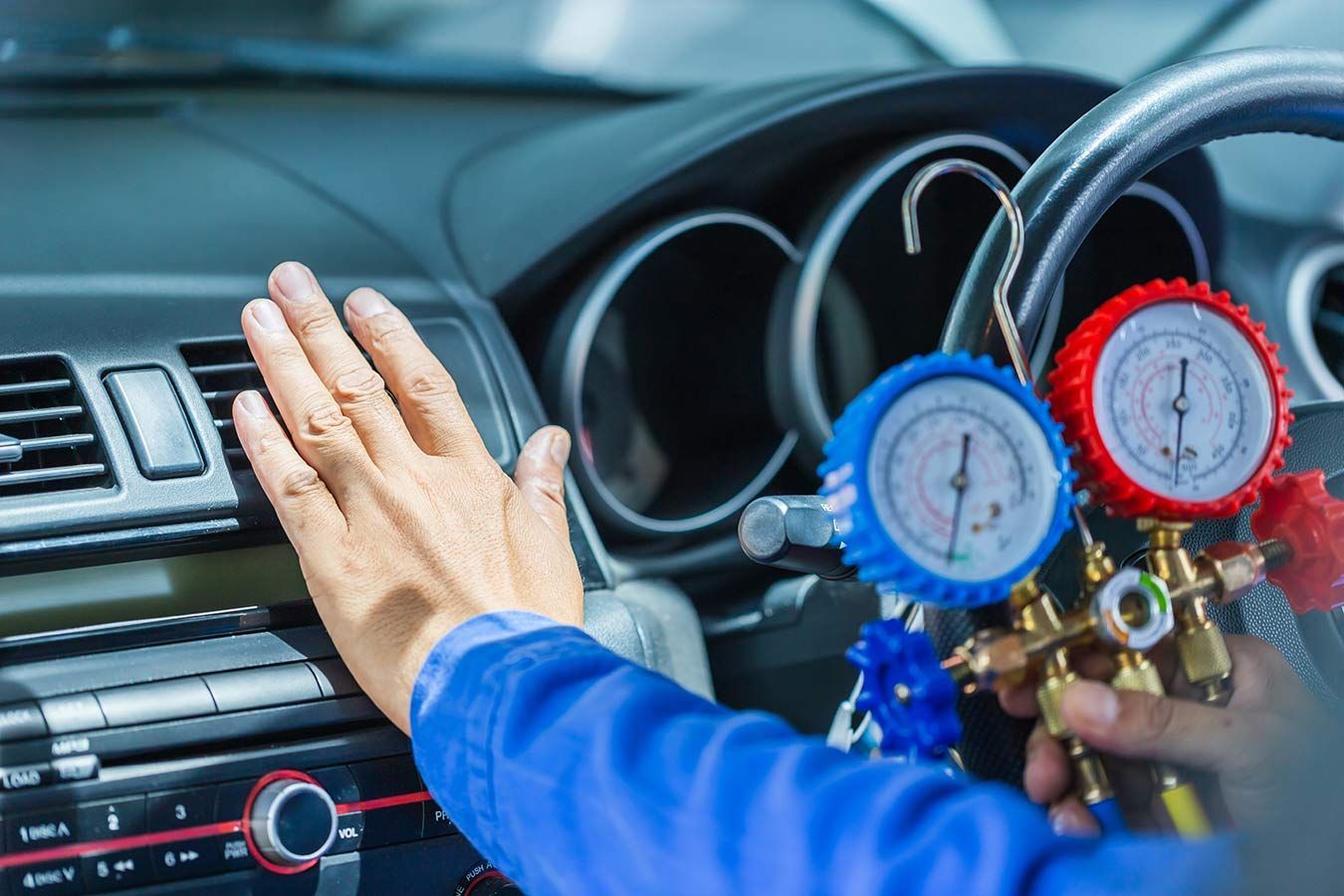 A Person Is Adjusting The Air Conditioner In A Car — Edmonton Car Air in Innisfail, QLD