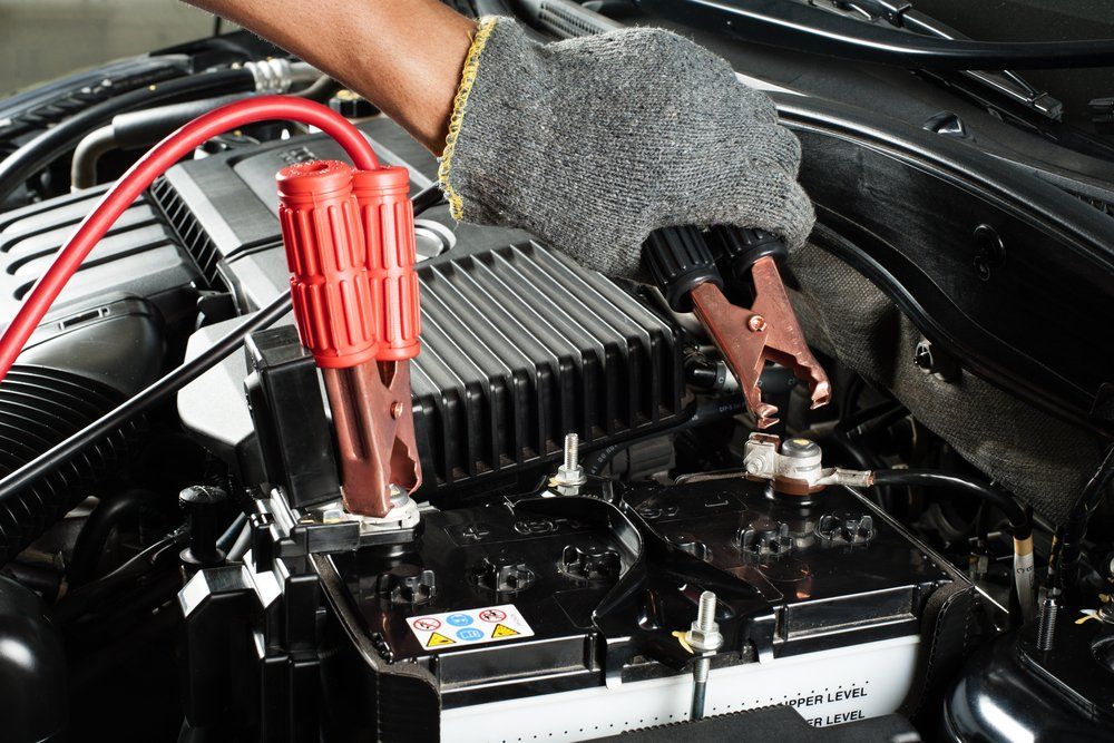 Car Battery with Jumper Cable in Engine Room — Edmonton Car Air in Bentley Park, QLD