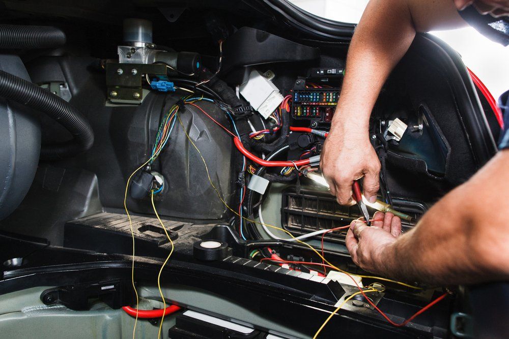 Electrician Works with Electric Block in Car — Edmonton Car Air in Bentley Park, QLD