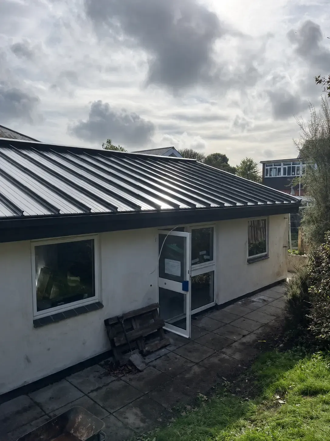 Completed standing seam metal roof installed by Nicholas Roofing Company