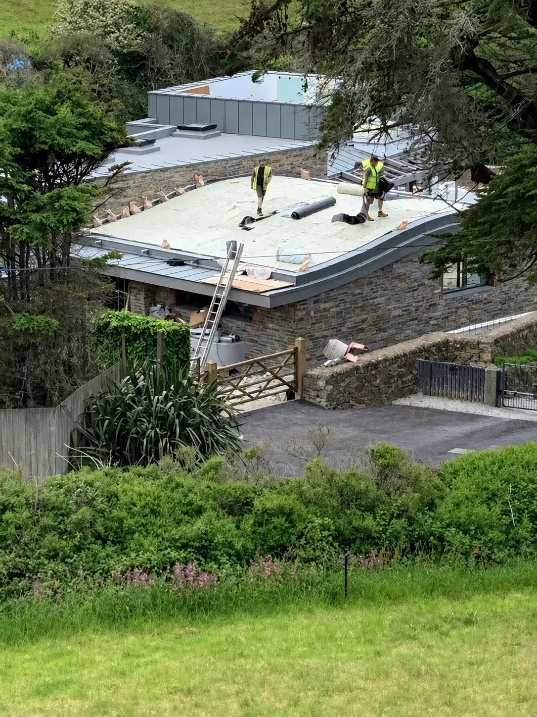 Nicholas Roofing Company team working on a flat roof installation