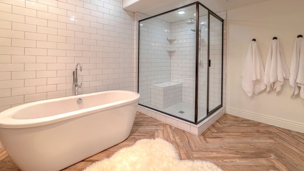 A Bathroom With a Bathtub and a Walk in Shower — Ideal Glass In Winnellie, NT