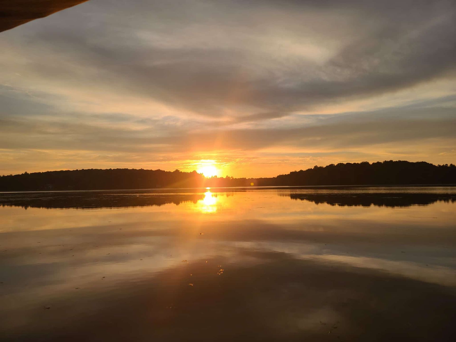 Two people are in a canoe on a lake