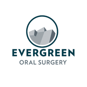 Logo for Evergreen Oral Surgery featuring a mountain icon within a blue circle and text.