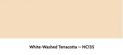 A rectangular swatch of light peach paint labeled White-Washed Terracotta - HC135.