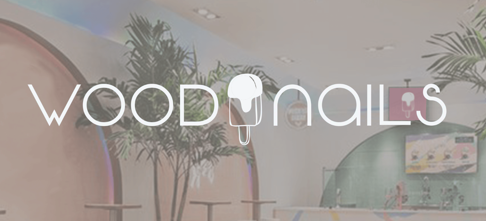 A logo for a nail salon called wood nails.