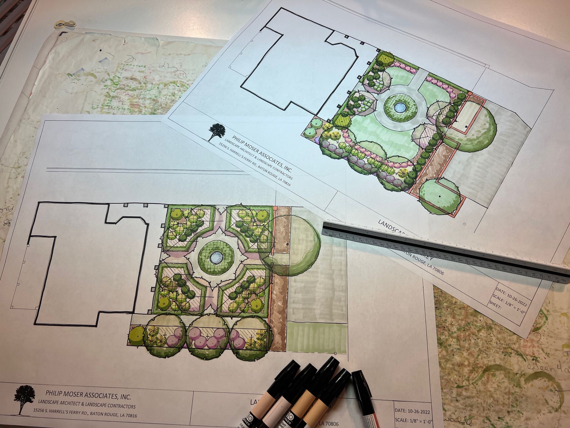 Landscape design plans with colored illustrations and markers.