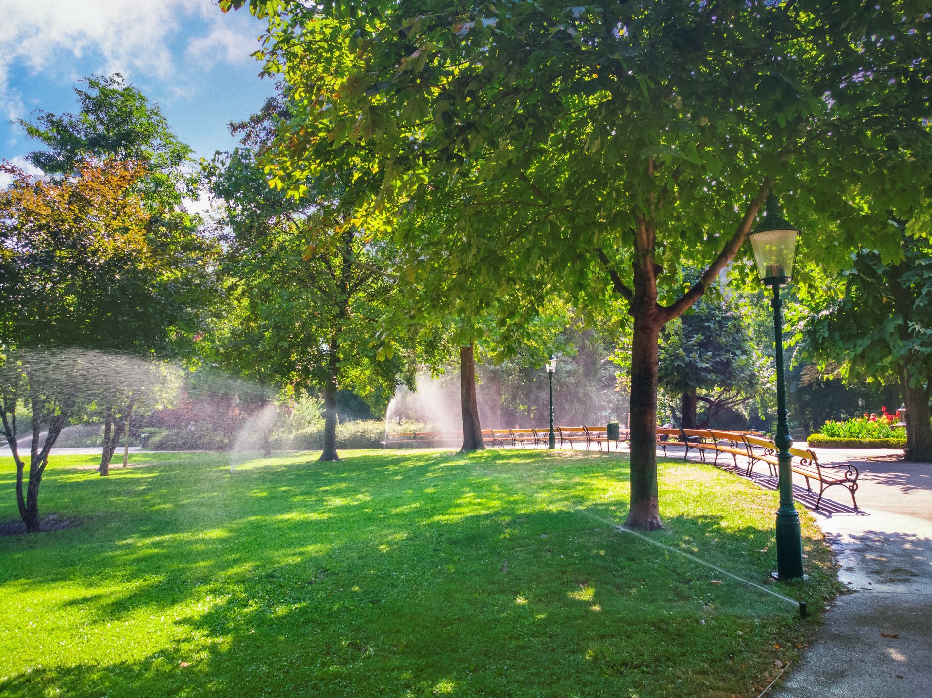 There is a fountain in the middle of the park.