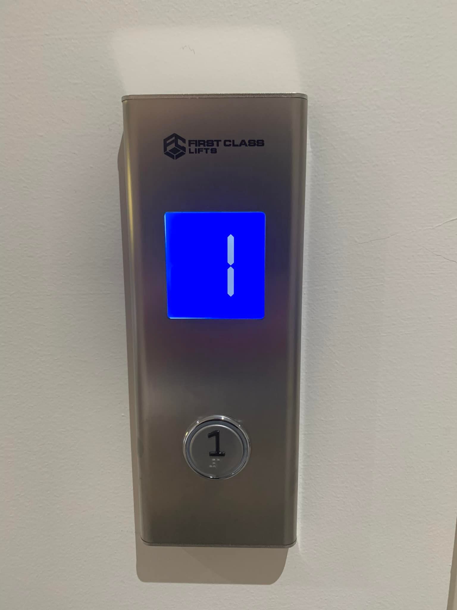 Elevator button panel showing the number
