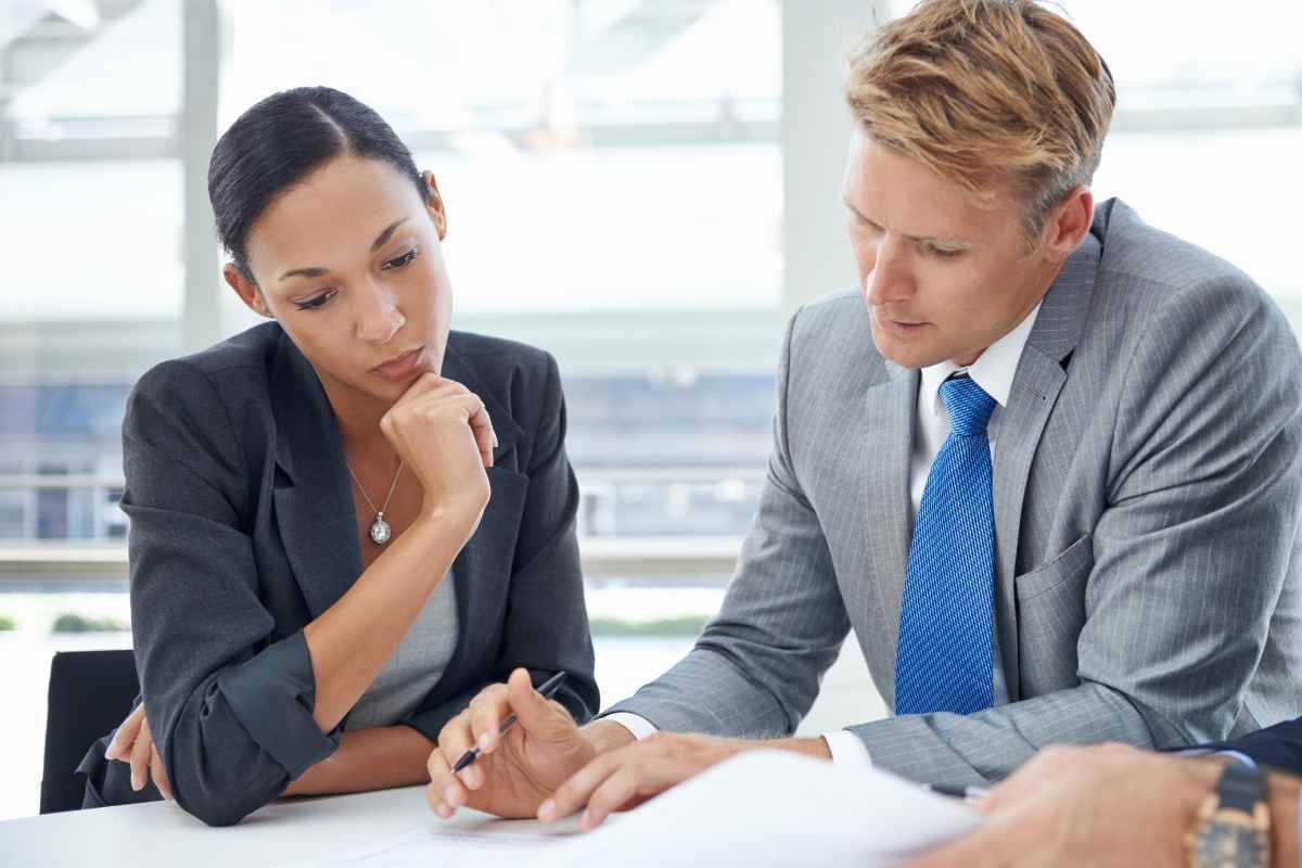 two individuals discuss financial goals