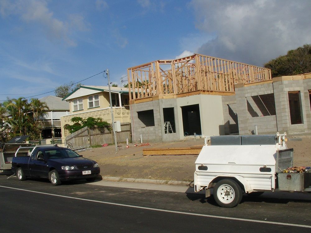 A car is parked in front of a house under construction — Integrabuild in Proserpine, QLD