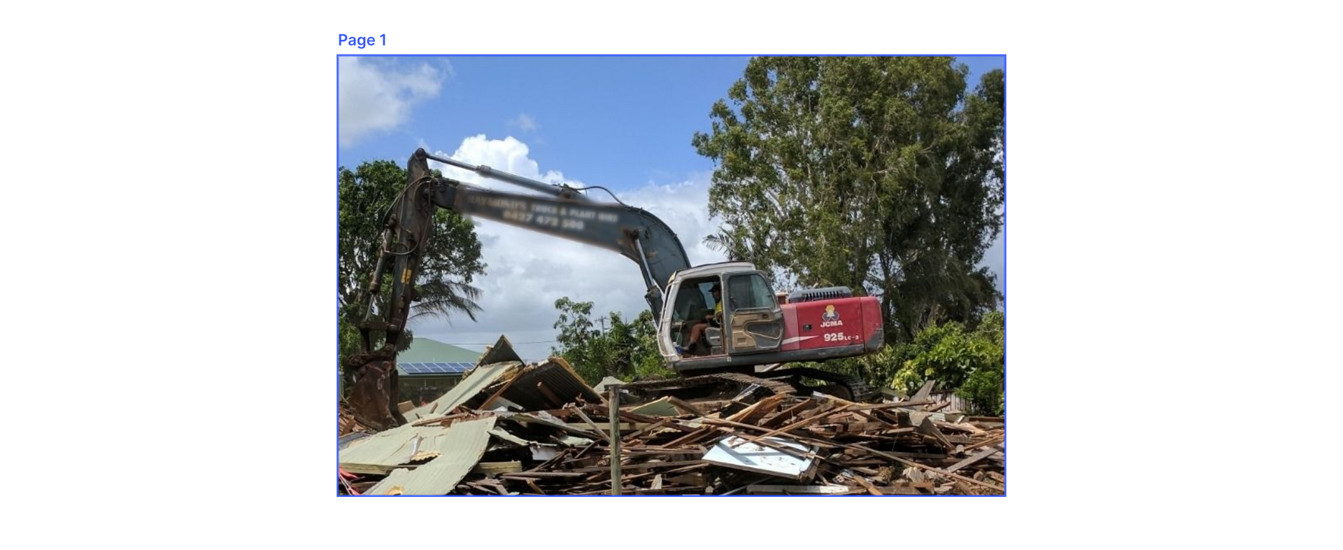 A Large Excavator Is Demolishing A Building — Integrabuild in Bowen, QLD