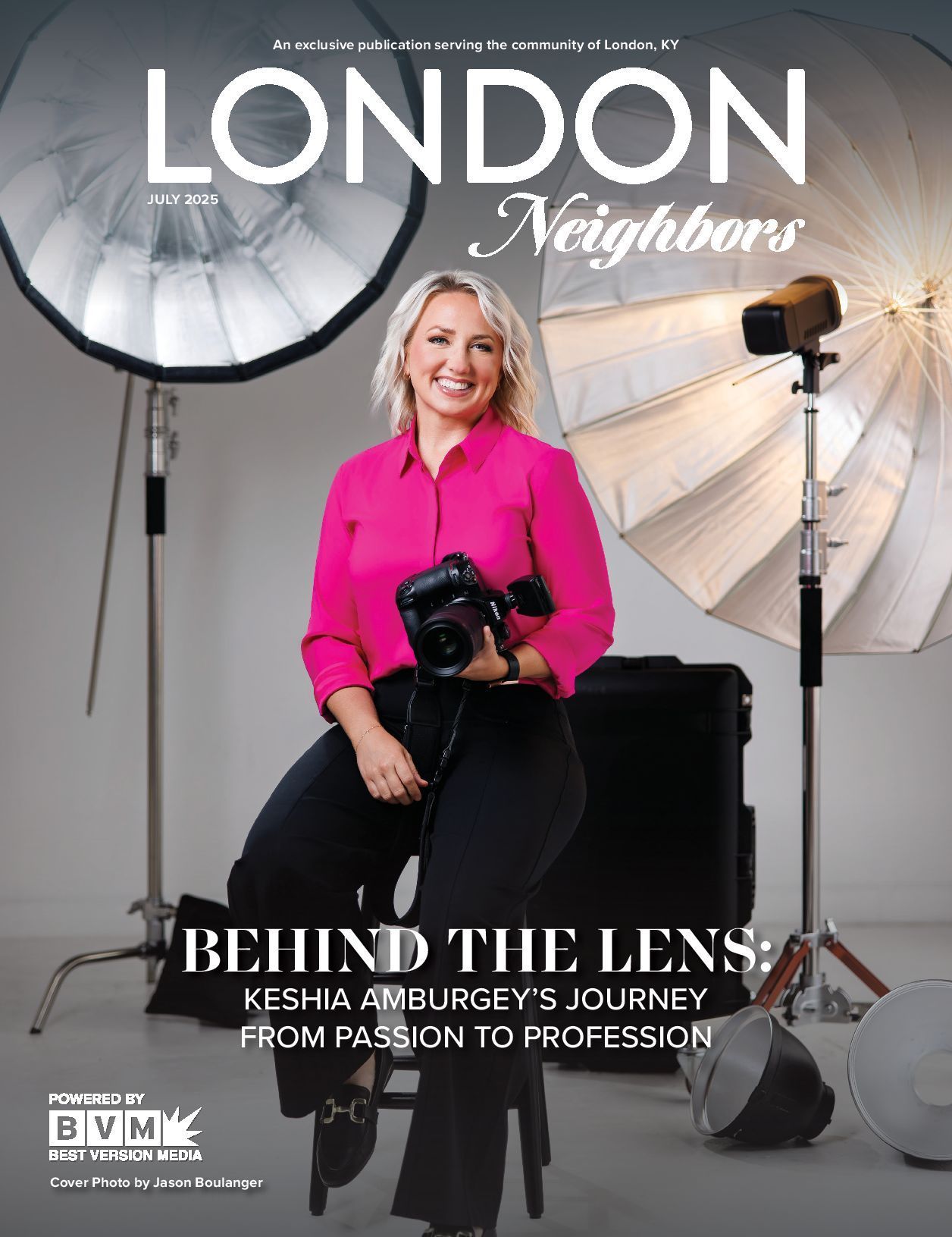 Woman with camera, seated in studio, for London Neighbors magazine. Headline: 