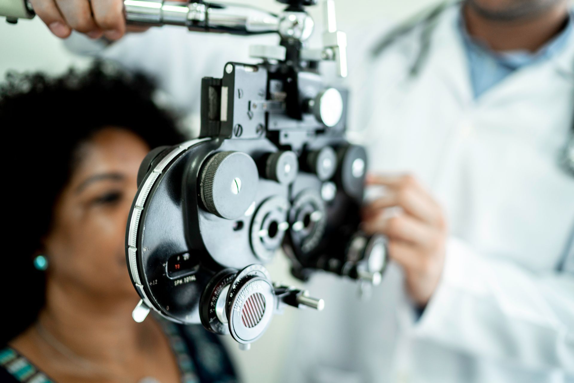 Mature women on a medical appointment with an ophthalmologist, checking for signs of Glaucoma Mature women on a medical appointment with an ophthalmologist, checking for signs of Glaucoma