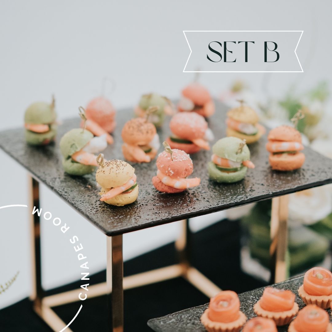 A tiered platter of colorful bite-sized appetizers, each skewered with a toothpick, ready for serving.